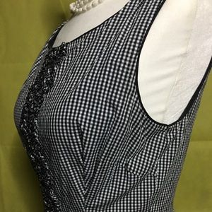 Black and white gingham dress with ruffles.